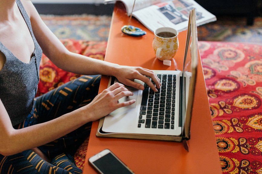 Photo of a women working on her laptop