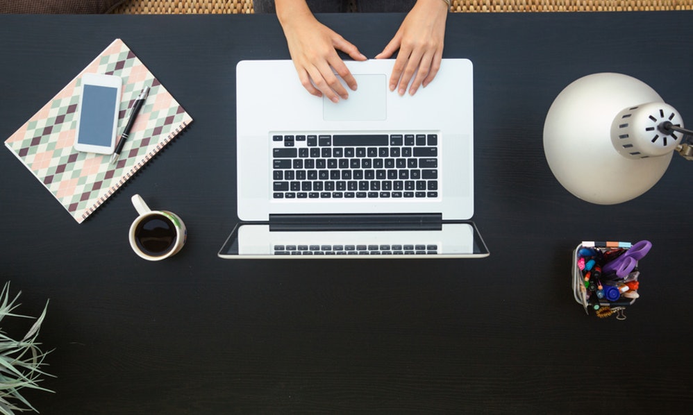 Overhead photo of a person working on their laptop