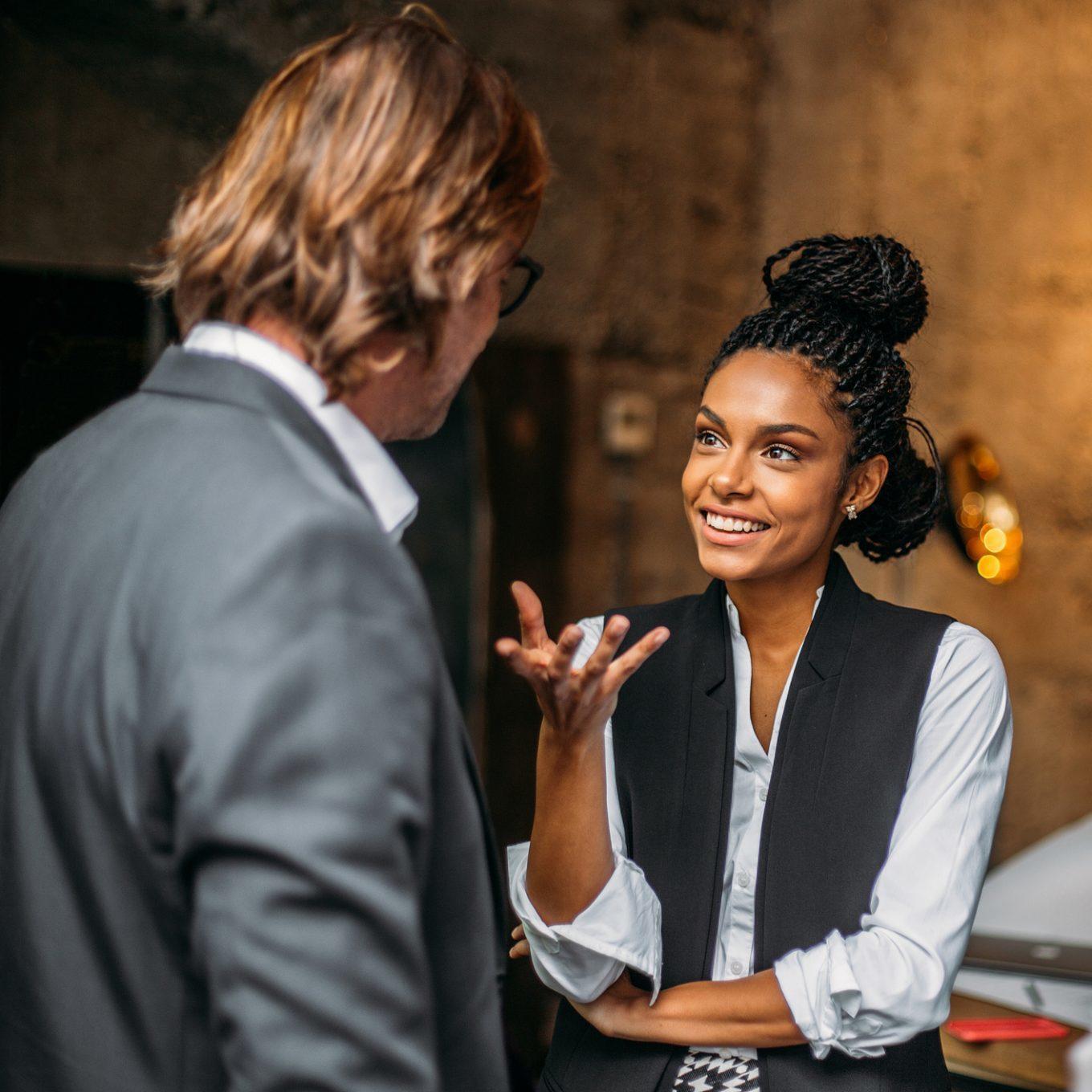 Photo of two co-workers having a discussion