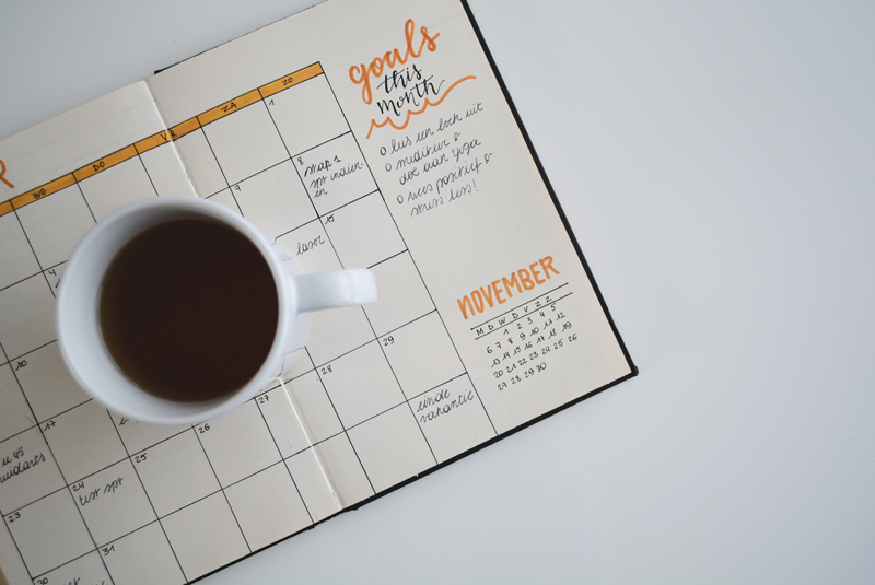 Photo of a coffee cup on a calendar
