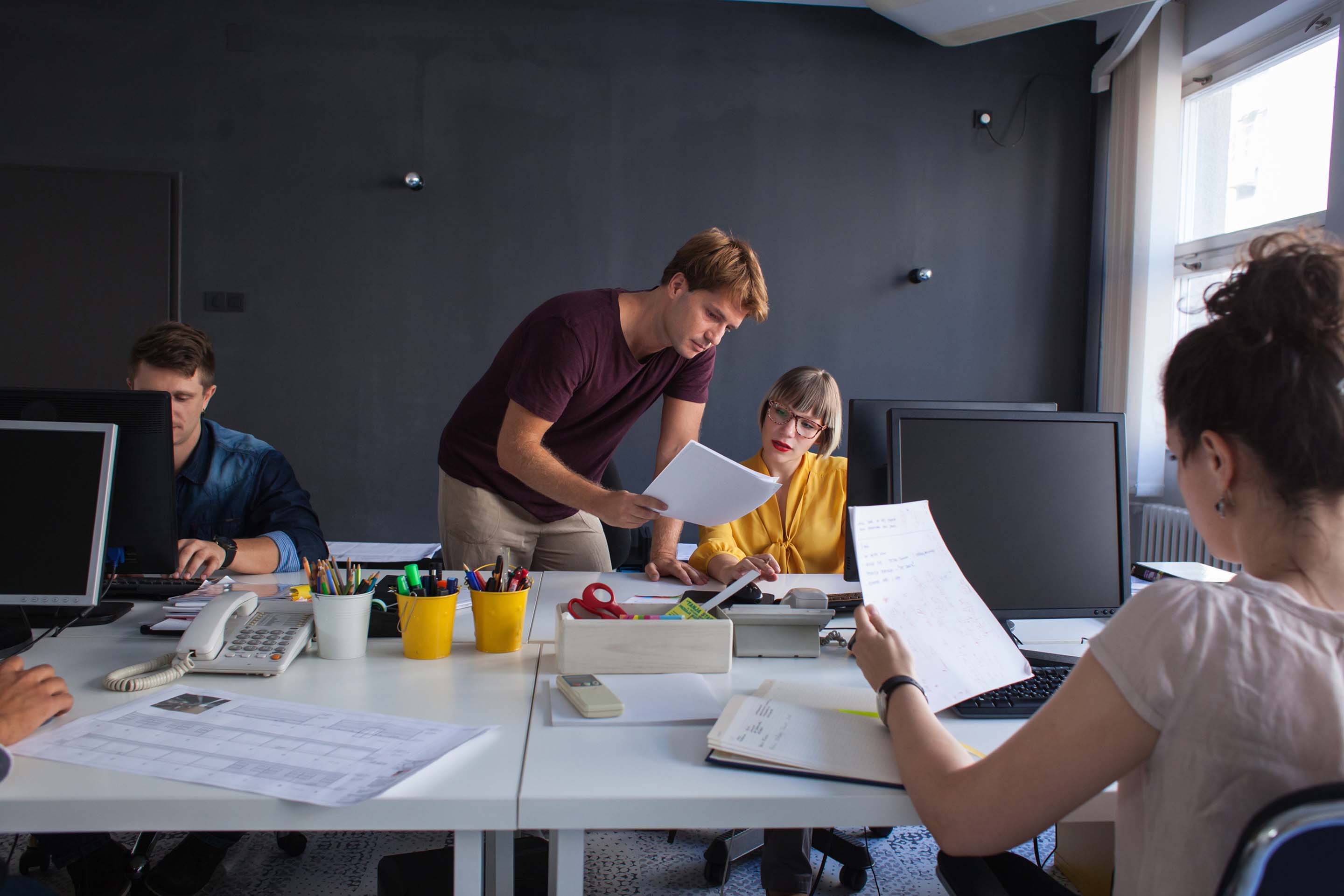 Photo of a team in an open-office workspace