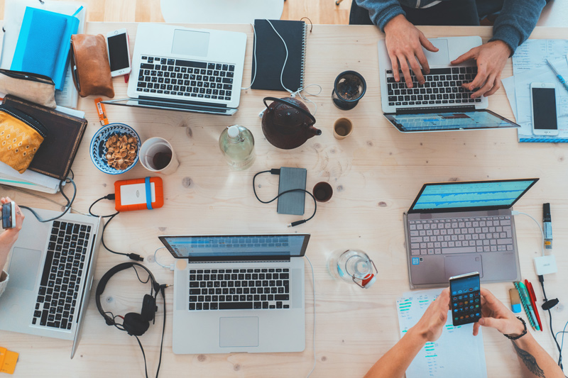 Overhead photo of a team's shared workspace