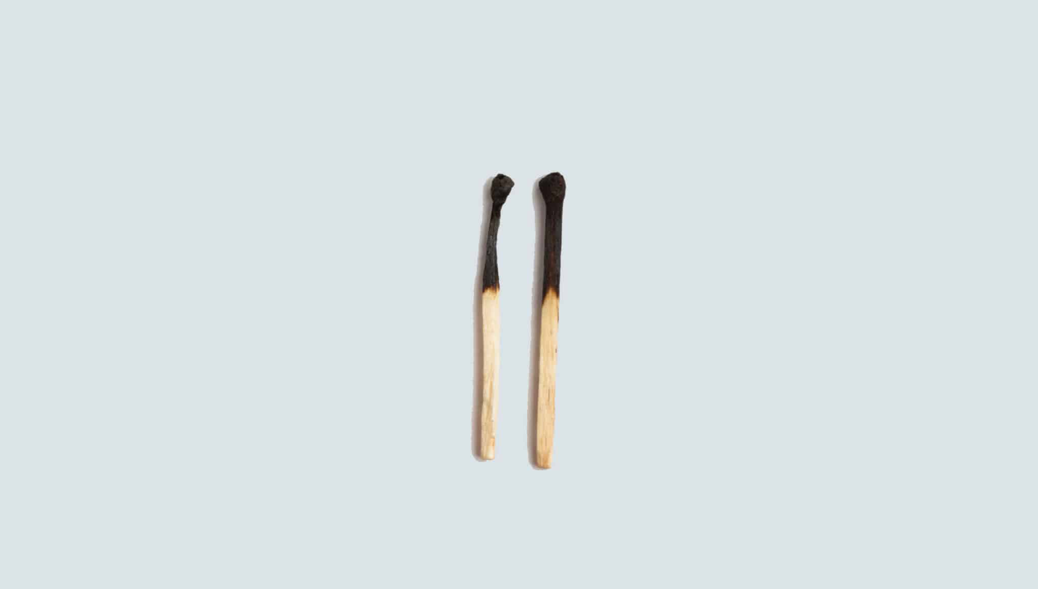 Photo of a two matchsticks next to each other