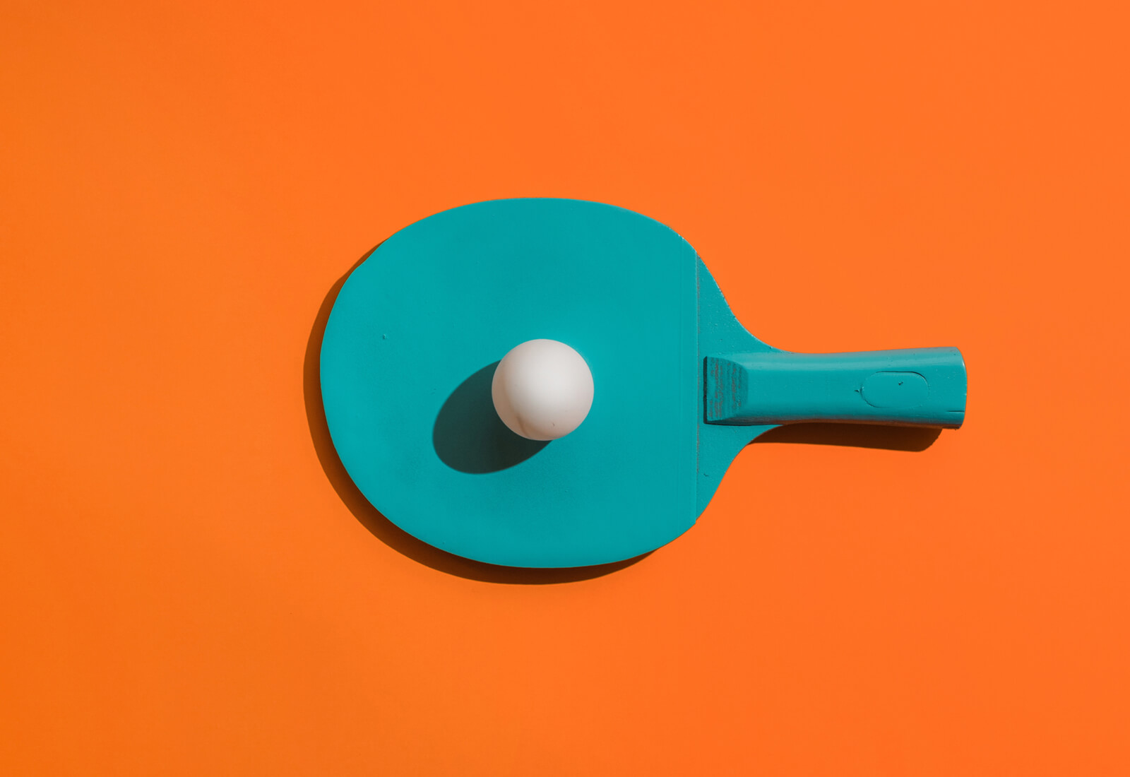 Team engagement is a pivotal part of a company's overall productivity, growth, and bottom line. Photo of a table tennis racket and ball